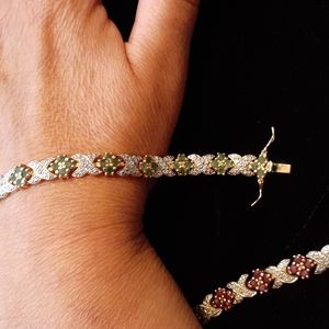 Gold over sterling emerald tennis bracelet 7.5"